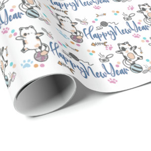 Happy New Year Between Kittens Balanced On A Yarn Wrapping Paper