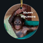 Happy Smiling Animal Baby Holiday Ceramic Tree Decoration<br><div class="desc">Here's a holiday ornament that helps to save orphaned wildlife. The orangutan baby on this ornament is one of hundreds of orphans on the island of Borneo. The artist donates 100% of all profits from the sale of this item to support the Care Centre where these babies are cared for...</div>