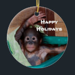 Happy Smiling Animal Baby Holiday Ceramic Tree Decoration<br><div class="desc">Here's a holiday ornament that helps to save orphaned wildlife. The orangutan baby on this ornament is one of hundreds of orphans on the island of Borneo. The artist donates 100% of all profits from the sale of this item to support the Care Centre where these babies are cared for...</div>