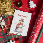 Happy Snowman Merry Christmas Custom Family Name Holiday Card<br><div class="desc">This charming holiday card features a joyful snowman illustrated in soft watercolor, adding a cheerful and festive touch to your holiday greetings. The inscription "Merry Christmas" is elegantly placed above the snowman, while the bottom of the card offers a customisable space for your family name, making it uniquely personal. On...</div>