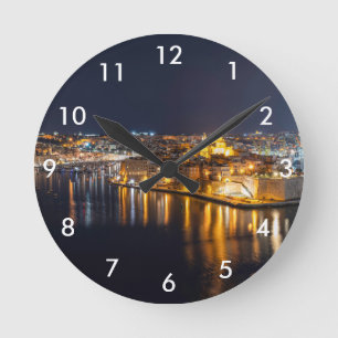 Harbor in Malta illuminated at night Round Clock