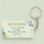 Hard of Hearing Deafness Alert Green Leaves Key Ring<br><div class="desc">Another cute hard-of-hearing keyring by JessicaAmber - message me about custom orders! This keyring features the slogan 'Hard of Hearing' in a narrow font, surrounded by a green wreath of leaves, on a pale green background. Underneath is an area for more info on your disability. On the back is space...</div>