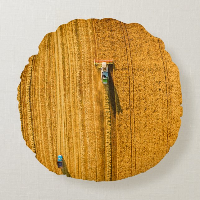 Harvester machine working in field. Combine harves Round Cushion (Front)