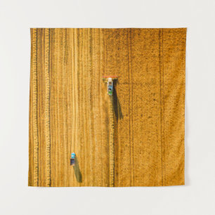 Harvester machine working in field. Combine harves Tapestry