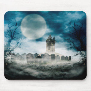 Haunted house on scary graveyard. Halloween scene. Mouse Mat