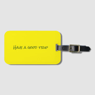 "Have a good trip" yellow luggage tag