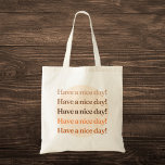 "Have a Nice Day!" Aesthetic Tote Bag<br><div class="desc">Brighten your day and spread positivity with our "Have a Nice Day!" Aesthetic Tote Bag. This charming tote bag features the uplifting phrase "Have a nice day!" repeated five times in varying shades of brown, beige, and orange, creating a warm and inviting design. The colour gradient gives it a subtle...</div>