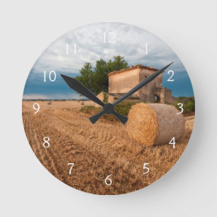 Hay bale in Provence field Round Clock