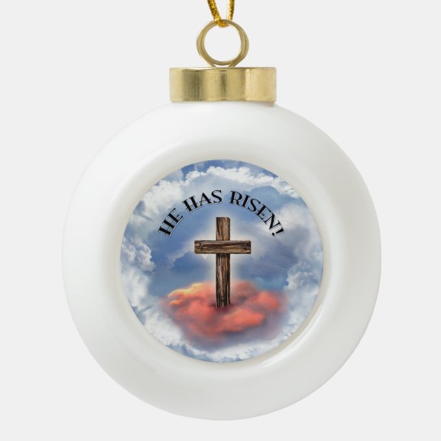 He Has Risen Rugged Cross With Clouds Ceramic Ball Christmas Ornament (Front)