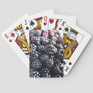 Heap of blackberries playing cards