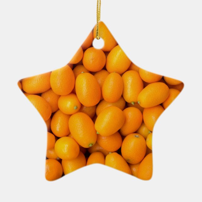 Heap of orange kumquats in cardboard box ceramic tree decoration (Front)