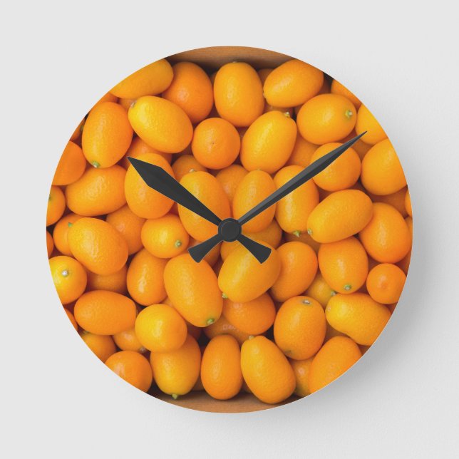 Heap of orange kumquats in cardboard box round clock (Front)