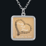 Heart in Sand Custom Couple Wedding Date Necklace<br><div class="desc">This cute necklace features an image of a heart drawn in the sand with the name of the happy couple on it. Personalise it with your names or the names of the couple you are purchasing it for. Underneath the heart is where you can put the Wedding or Engagement date....</div>