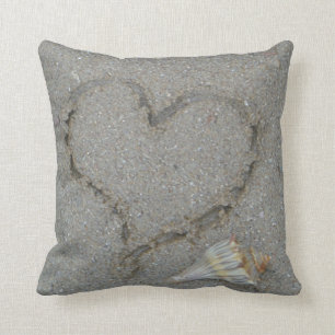 heart in the sand with shell cushion