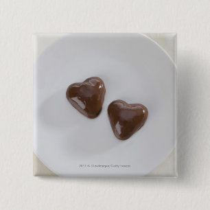 Heart shaped chocolate candies on a plate 15 cm square badge