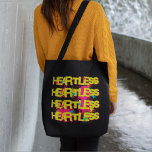 Heartless Graffiti Grunge Tote Bag<br><div class="desc">This graffiti-inspired design features the word "heartless" in a funky,  yellow font with a pink shadow. Splotches of bright pink,  blue,  and yellow form the background.</div>