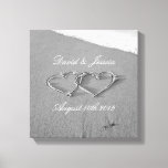 Hearts in the sand beach photography canvas print<br><div class="desc">Hearts in the sand drawing beach photography canvas print Romantic home decor for newly weds / married couple. Elegant script typography for weding date plus names for bride and groom / husband and wife couple. Classy black and white or sephia coloured photograph. Drawn entwined hearts at a sandy honeymoon beach...</div>