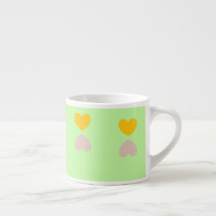 Hearts shapes on light green espresso cup