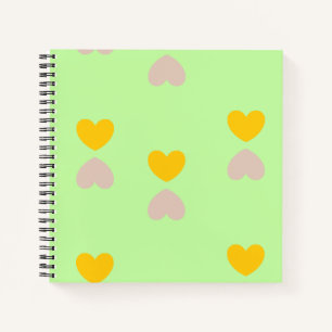 Hearts shapes on light green notebook