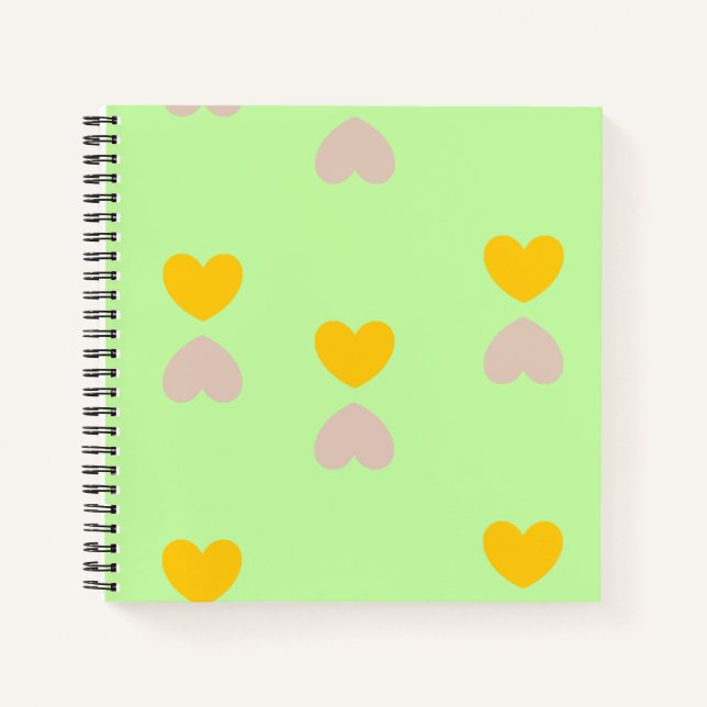Hearts shapes on light green notebook (Front)