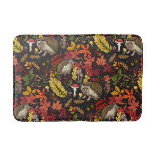 Hedgehogs and autumn forest flora on black bath mat