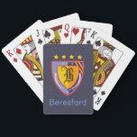 Heraldry Playing Cards<br><div class="desc">Emblazon your surnname and initial on a colourful heraldic crest. A classic and elegant design that speaks of days of yore – in shades of royal blue, gold and red, a shield and two scimitars border a central shield to display your surname initial. Stars and three pheon complete the design....</div>
