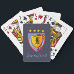 Heraldry Playing Cards<br><div class="desc">Emblazon your surnname and initial on a colourful heraldic crest. A classic and elegant design that speaks of days of yore – in shades of royal blue, gold and red, a shield and two scimitars border a central shield to display your surname initial. Stars and three pheon complete the design....</div>