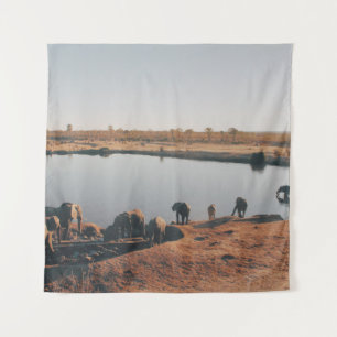 HERD OF ELEPHANT DRINKING WATER FROM LAKE TAPESTRY