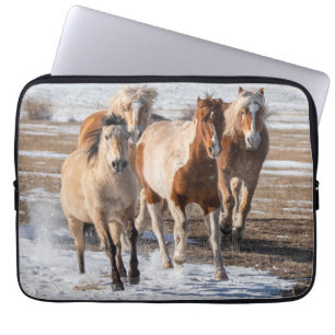 Herd of Mixed Breed Horses Running in the Snow Laptop Sleeve