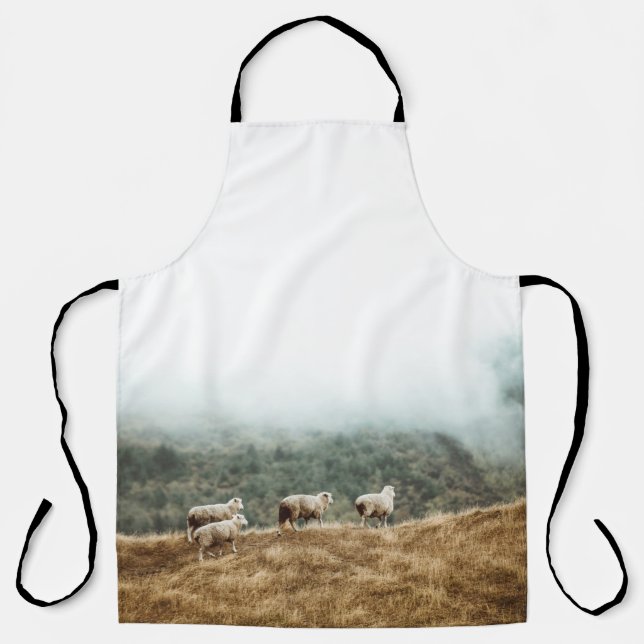 HERD OF SHEEP ON BROWN GRASS FIELD DURING DAYTIME APRON (Front)