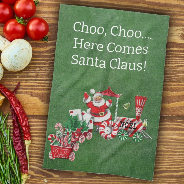 Here Comes Santa on Candy Christmas Train Green Tea Towel (Here come Santa riding Christmas train with candy, letters on green kitchen Chrismtas towel.)