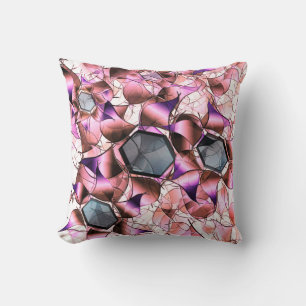 Hexagons surrounded by pinkish petal-like shapes cushion