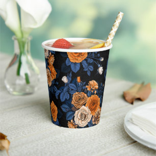 Hidden in the roses, orange and blue paper cups