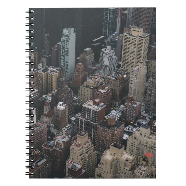 HIGH-ANGLE PHOTOGRAPHY OF CITY BUILDING S NOTEBOOK (Front)