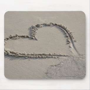 High angle view of a heart shape on the beach mouse mat