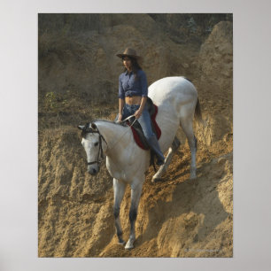 High angle view of a young woman riding a horse poster
