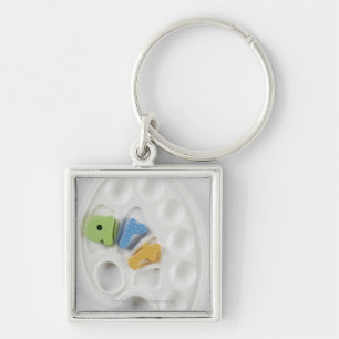 High angle view of alphabets on a palette key ring
