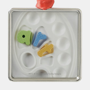 High angle view of alphabets on a palette metal tree decoration
