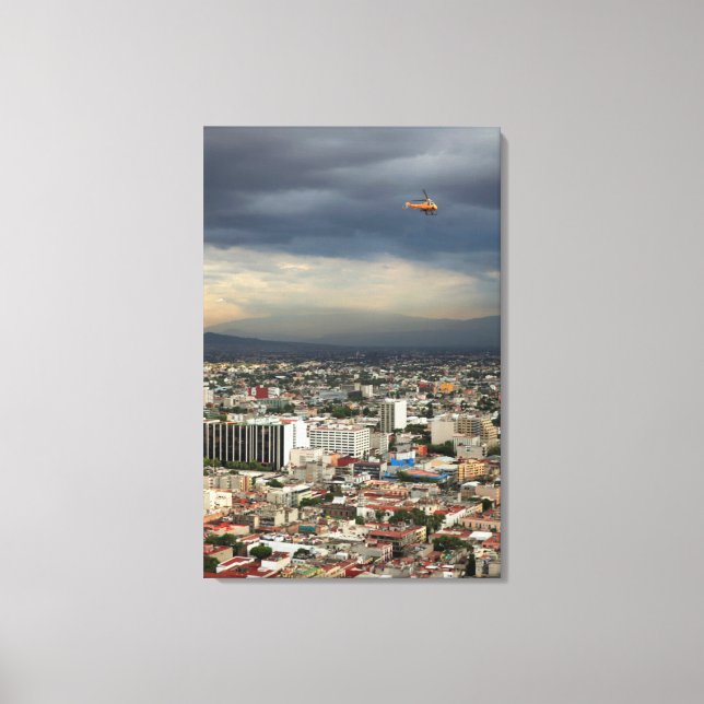 High Angle View Of Cityscape Against Cloudy Sky Canvas Print (Front)