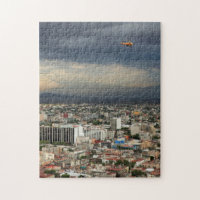 High Angle View Of Cityscape Against Cloudy Sky