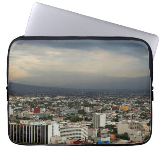 High Angle View Of Cityscape Against Cloudy Sky Laptop Sleeve