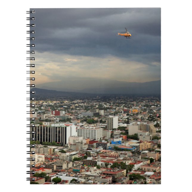High Angle View Of Cityscape Against Cloudy Sky Notebook (Front)