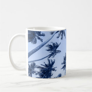 High palm trees, clear blue sky. coffee mug