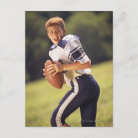 High school quarterback with football