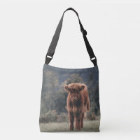 Highland cow calf autumn grass field