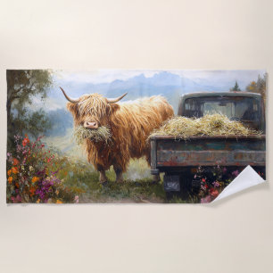 Highland Cow Eating Hay Beach Towel