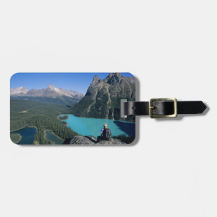 Hiker overlooking turquoise-coloured Lake Luggage Tag