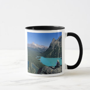Hiker overlooking turquoise-coloured Lake Mug
