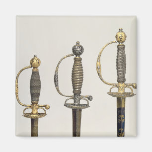 Hilts of three French swords: one of steel Magnet