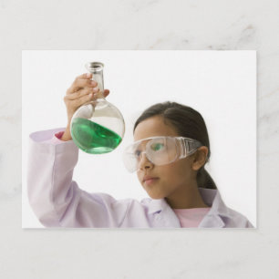 Hispanic girl looking at liquid in beaker postcard